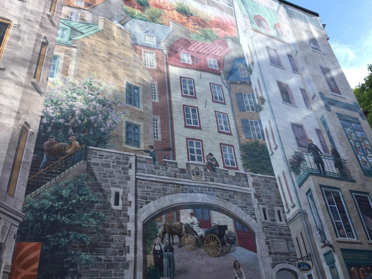 Taking in a mural of historical Quebec in Lower Town