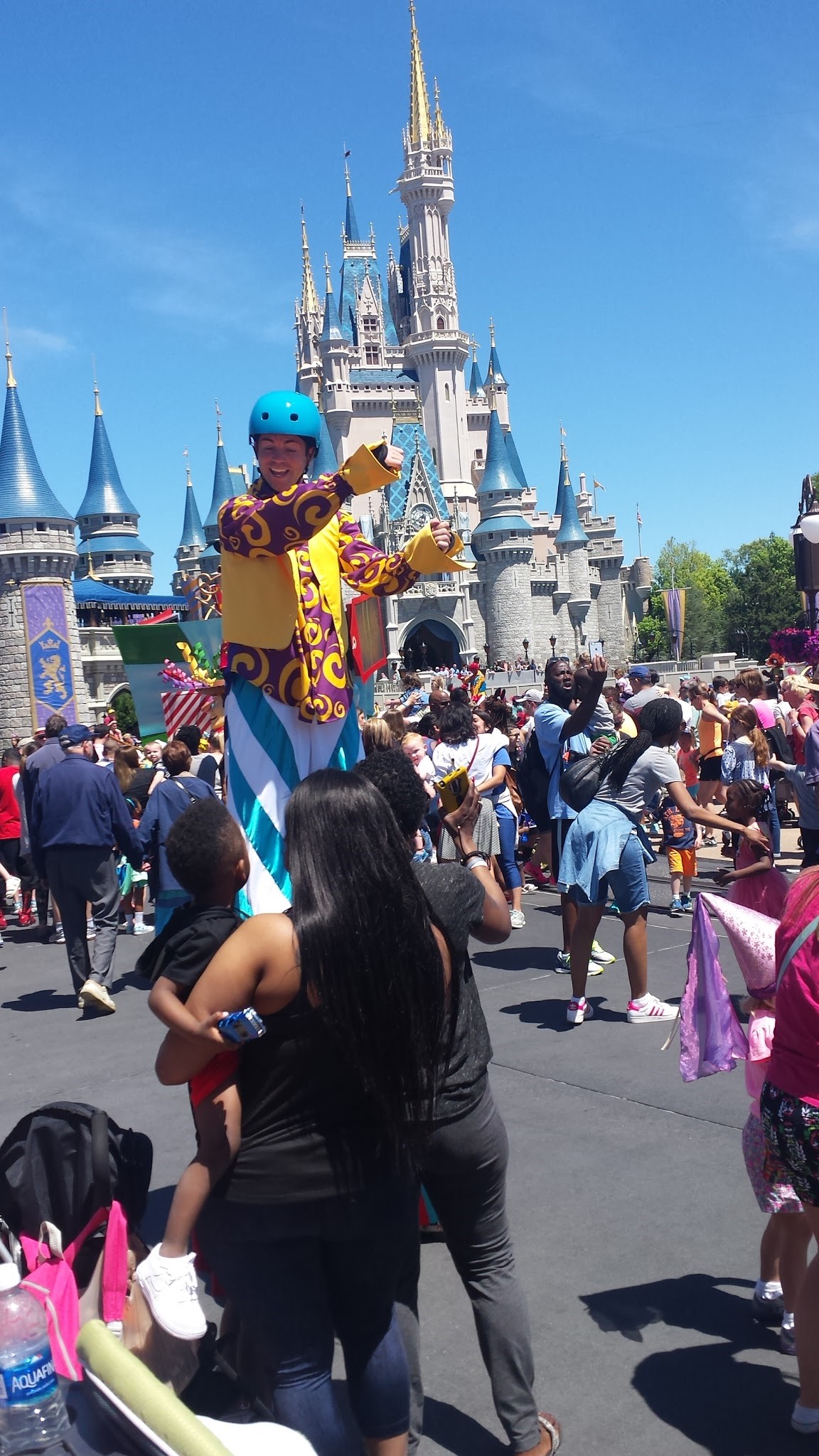 Kickin it during the dance party Magic Kingdom has every day. It features people on stilts and Mickey Mouse. It's the best.